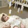 white and gold baby mobile